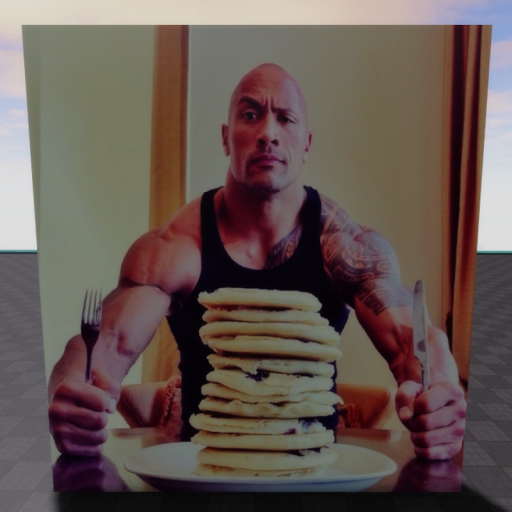 Sitting in front of the rock while he eats pancake